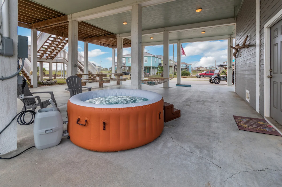 Hot Tub Golf Cart Near beach Coastal Retreat property photo 2