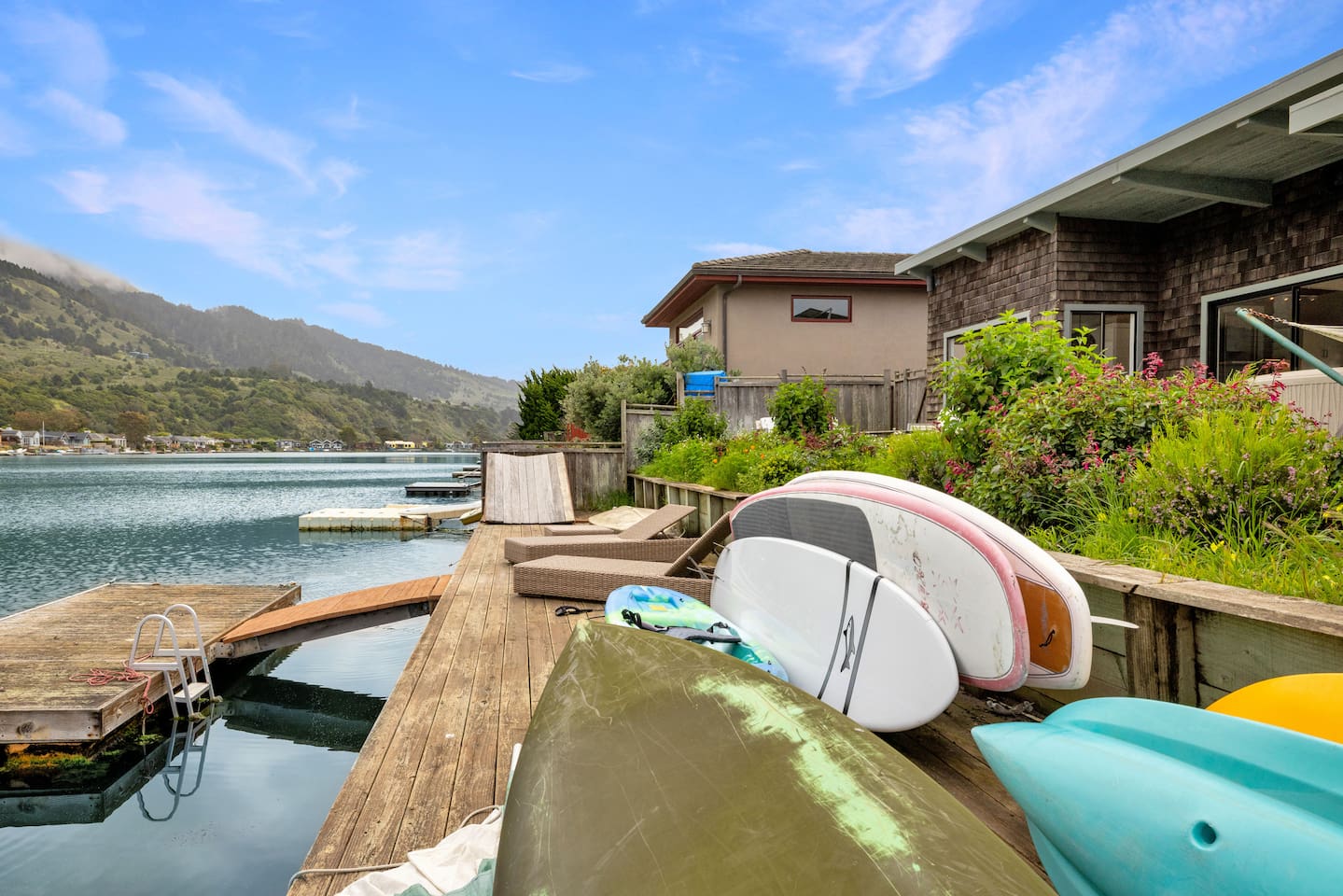 Stinson Beach lagoon dock with kayaks and paddleboards