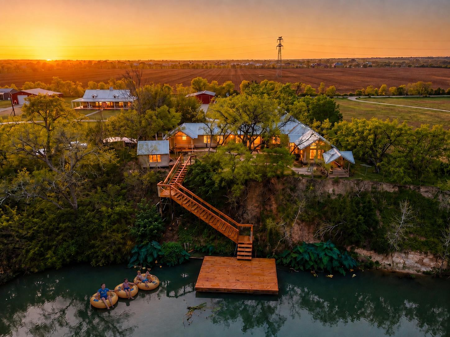 Private dock on the spring-fed San Marcos River at the Hilco riverfront estate in Martindale, Texas, with cypress along the bank