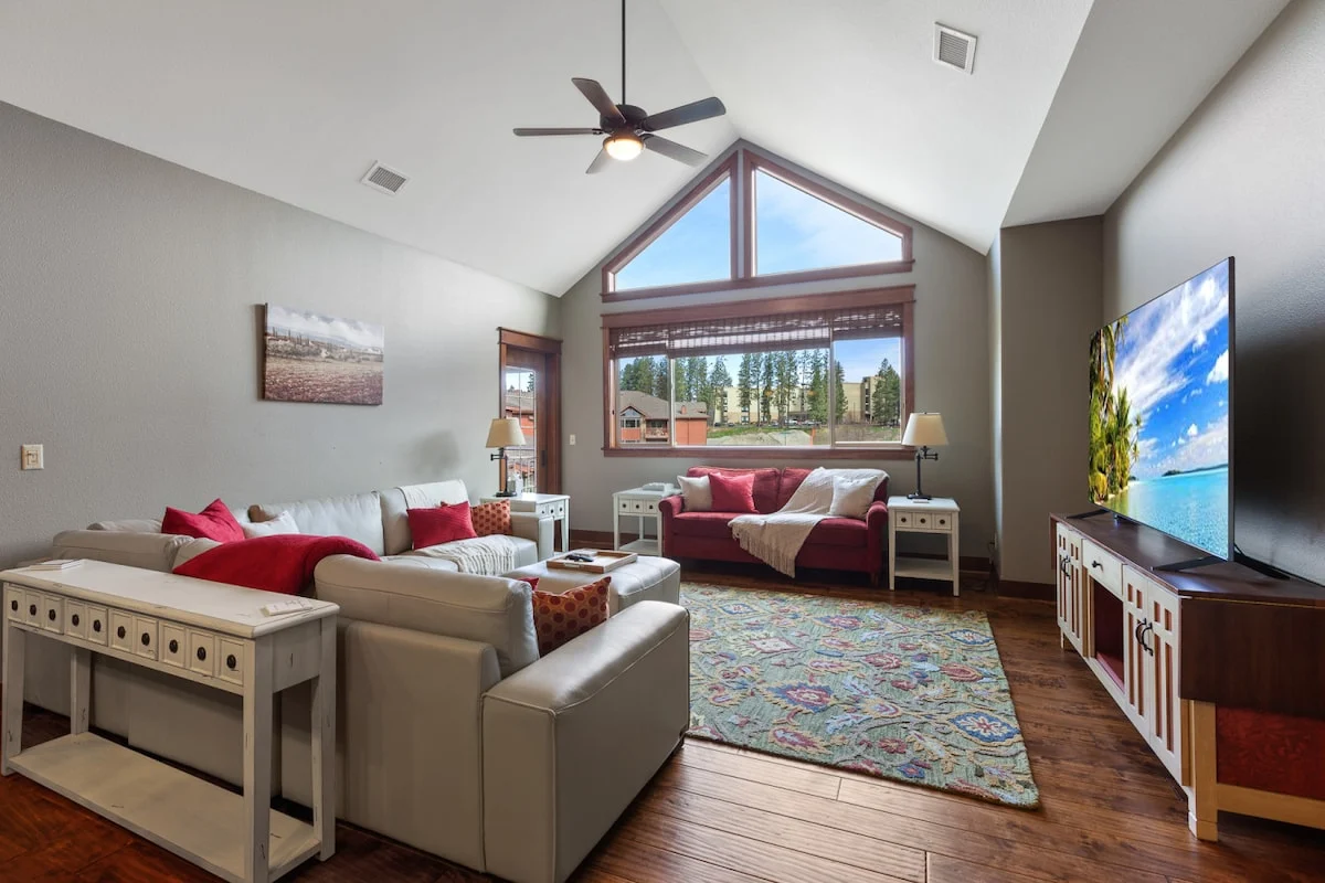 Vaulted-ceiling living room at The Bellerose, a Riverstone condo sleeping eight with covered parking
