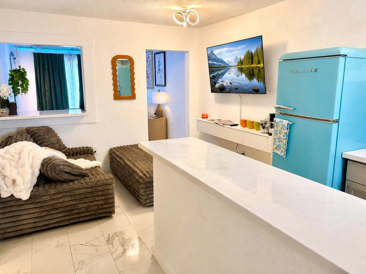 Living area and retro turquoise refrigerator at The Cozy Koi boutique studio near the Coeur d'Alene Resort