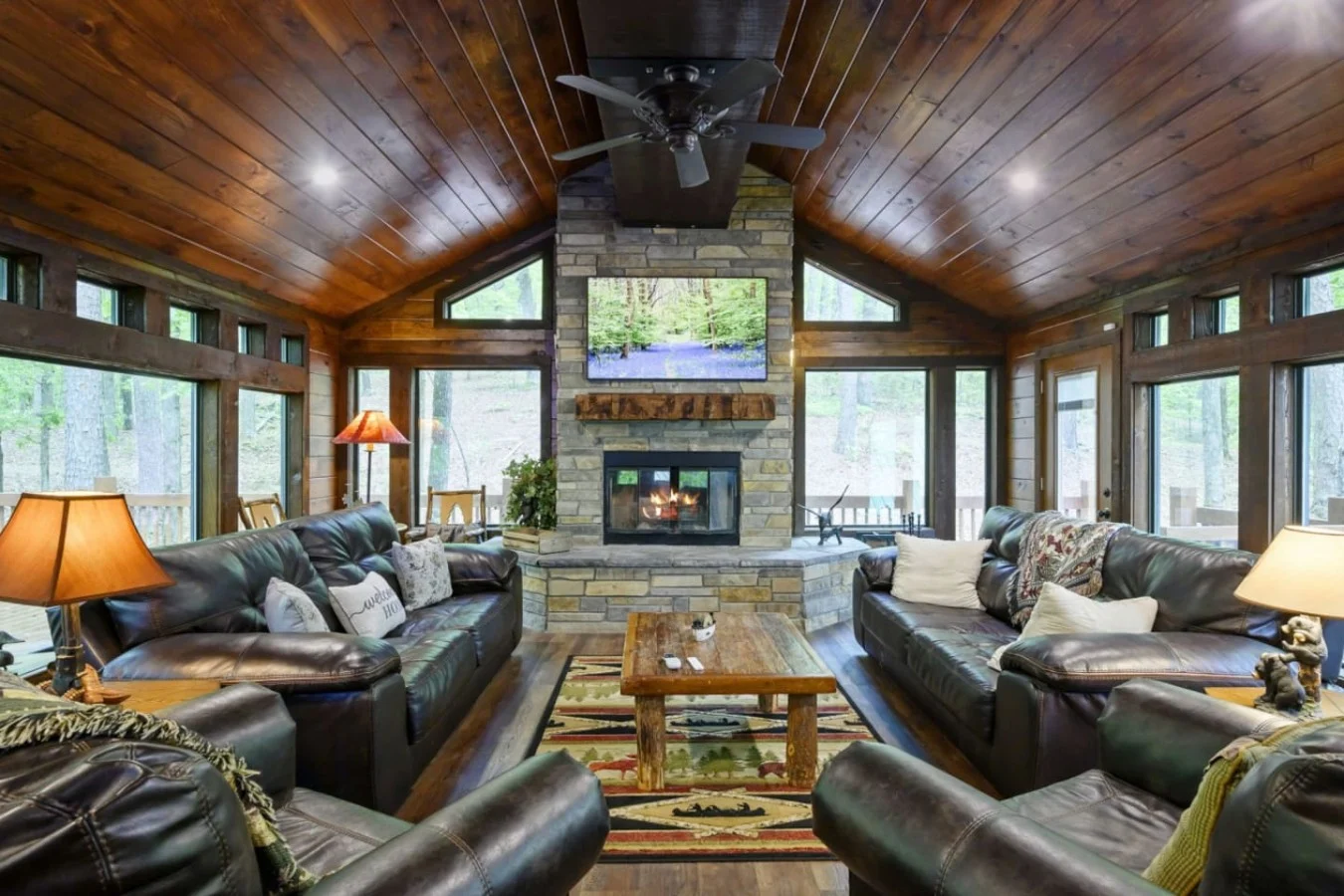 Bent Pine Lodge cabin exterior in the pine woods between Broken Bow and Hochatown, Oklahoma, with hot tub and firepit