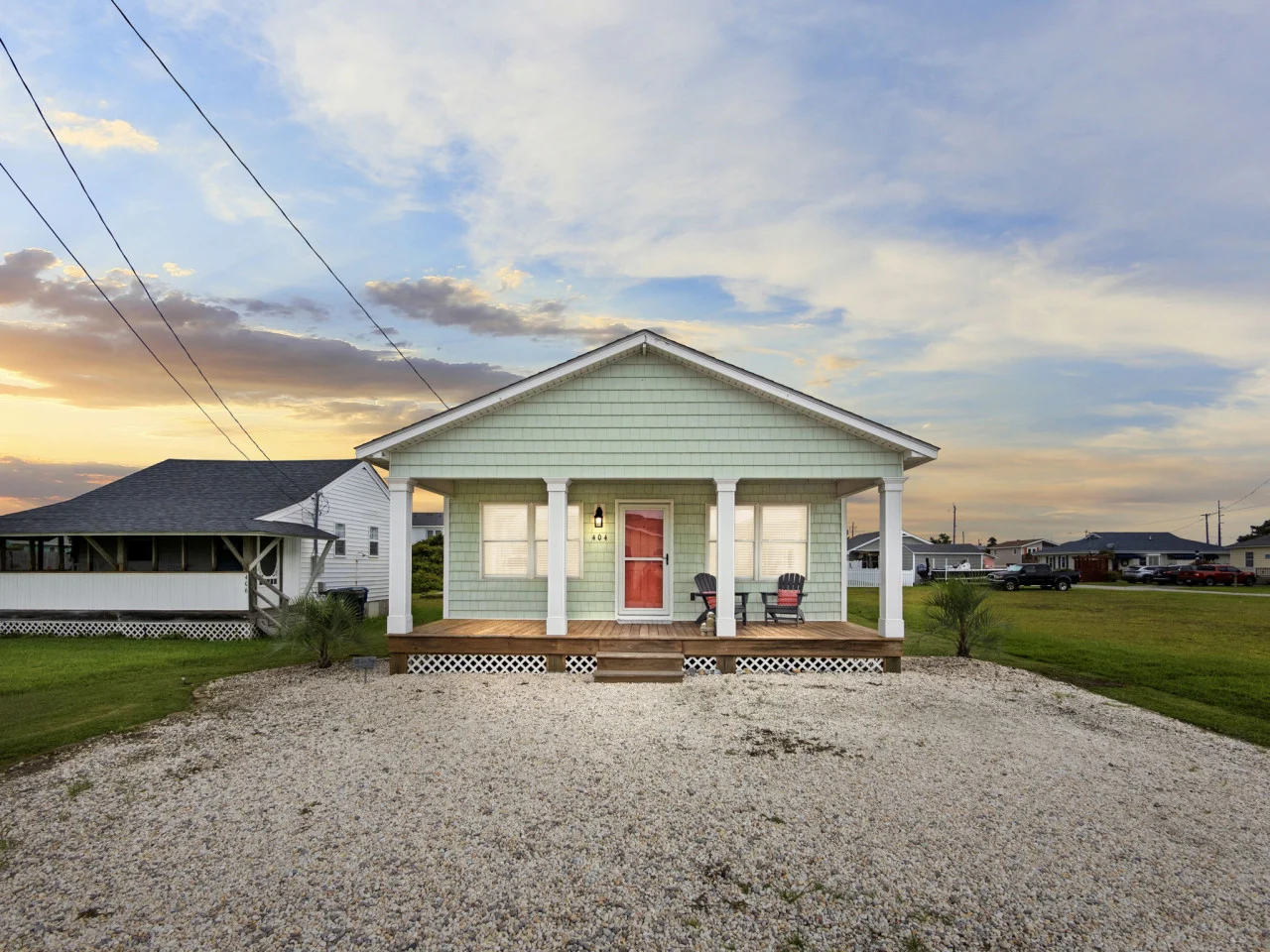 AB Sea Digs, a two-bedroom coastal cottage in Atlantic Beach, with patio seating and the outdoor shower