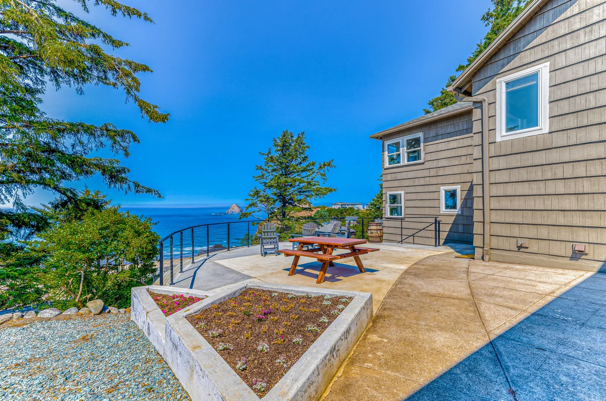 Quaint ocean view escape with modern interior smart TV and gorgeous deck property photo 1