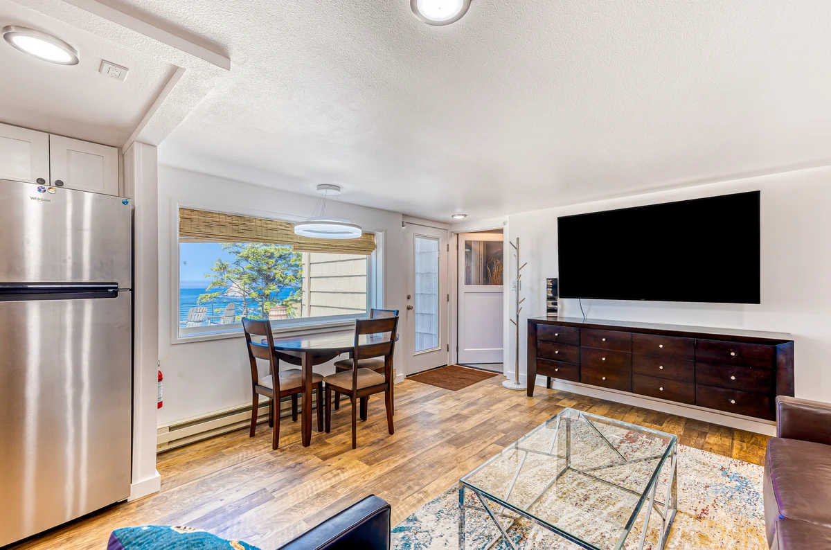 Quaint ocean view escape with modern interior smart TV and gorgeous deck property photo 2