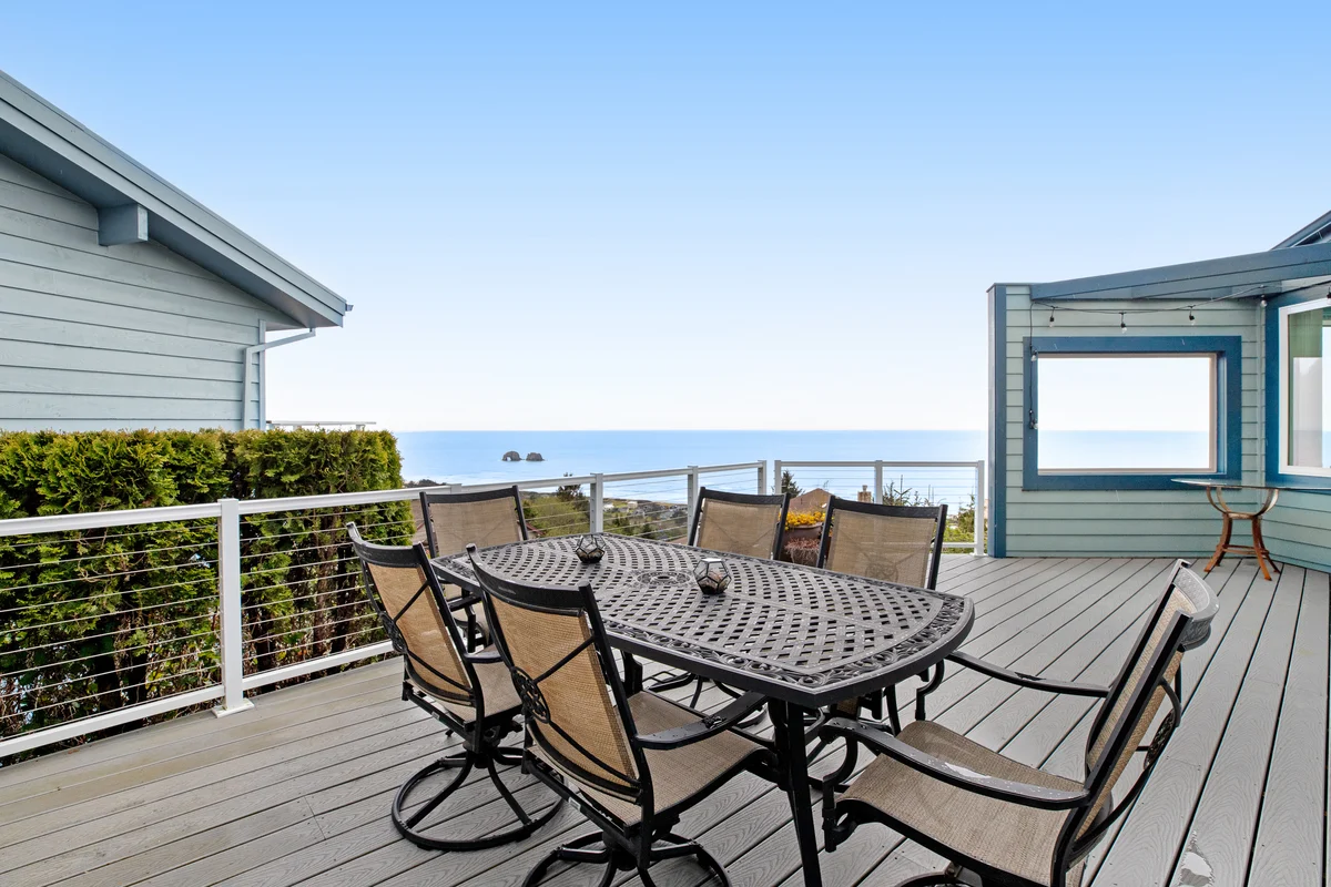 Ocean view home with a deck gas grill free WiFi and washer dryer property photo 2