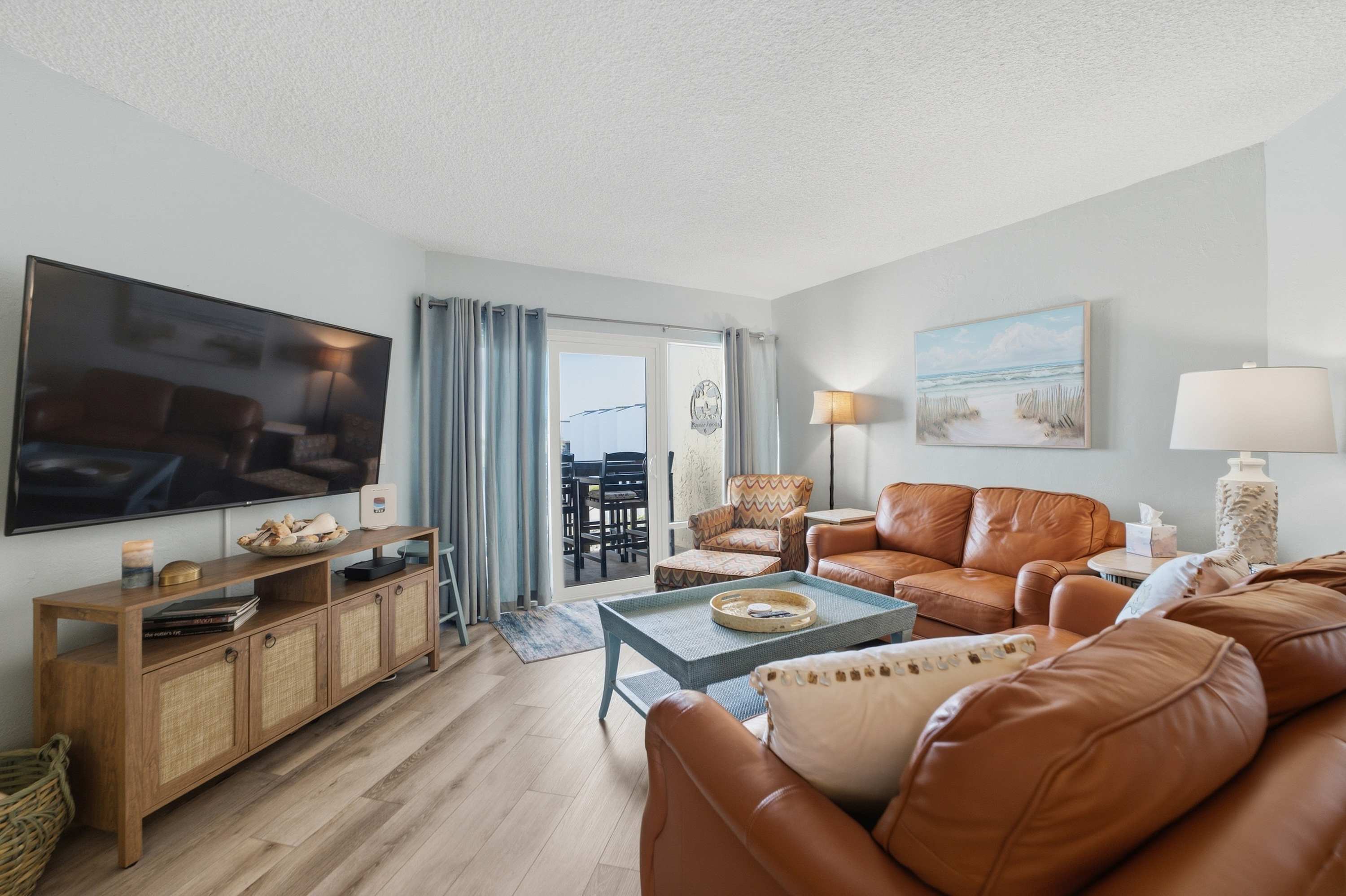 Balcony and living area of the Dove's Island Nest two-bedroom condo in St. Augustine with ocean views