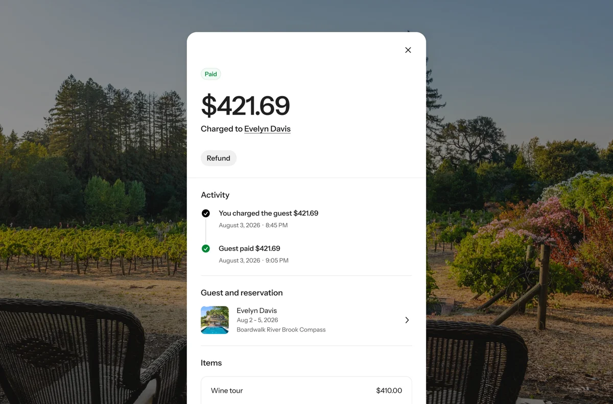 Wander Custom Charges showing a paid $421.69 wine tour charge and its payment activity over a vineyard background.